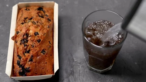 A glass of tea and a muffin. Stock Footage 296196877