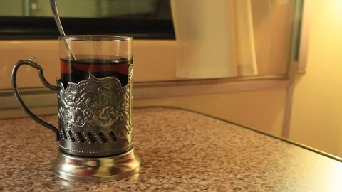 Glass of tea in a cup holder Stock Footage 88362466