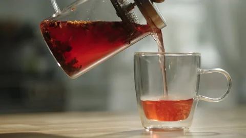 Glass Tea Infuser Pouring Tea Stock Footage 169284416