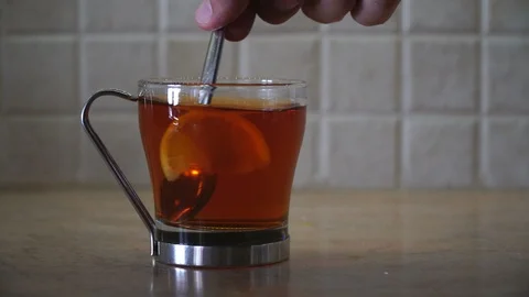 A Glass Of Tea with A Lemon Slice Stock Footage 119388452