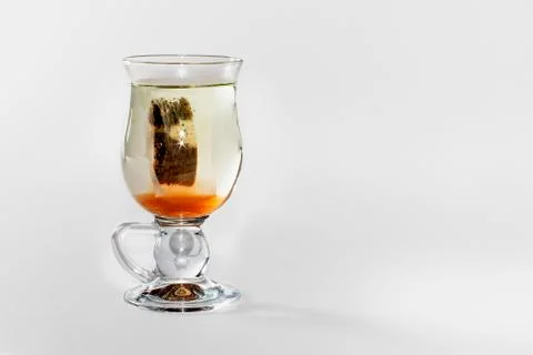 Glass of  tea with a teabag Stock Photos