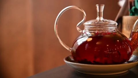 Glass teapot with fruit tea Stock Footage 247272860