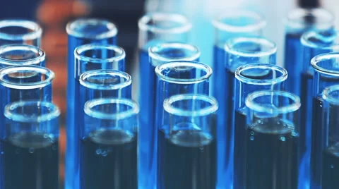Glass test tubes with blood samples. Close-up panning view. Video stock 65524226