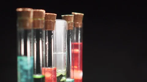 Glass test tubes with boiling multi-colored liquid. Stock Footage 124013295