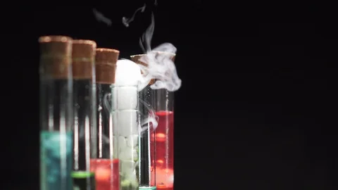 Glass test tubes with boiling multi-colored liquid. Stock Footage 125308587