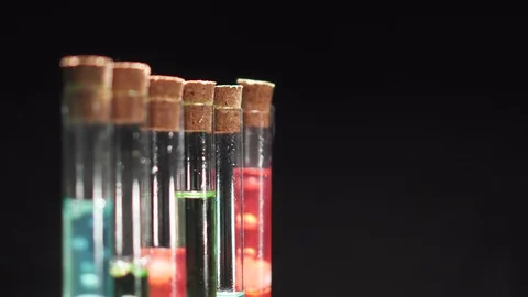 Glass test tubes with boiling multi-colored liquid. Stock Footage 125580736