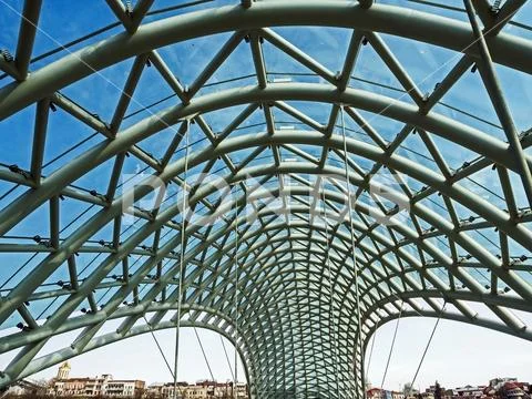 Photograph: Glass top of the bridge of Peace and view of the Kura river ...