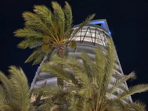 Glass tower elegance, dramatic angular tower with reflective glass and Stock Photos