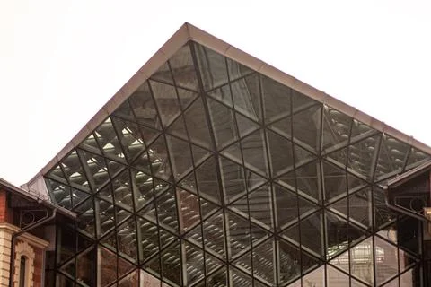 A glass triangular facade of house 写真素材