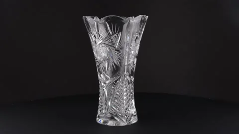 Glass vase rotating on a black background Stock Footage 142170149