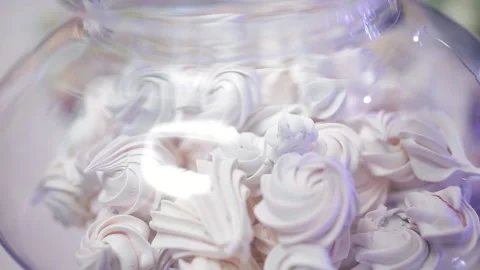 Glass vase with white marshmallows on the buffet table. Stock Footage 129706415