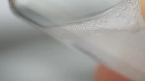 Glass vial containing medical solution prepared for injection Stock Footage 313635578