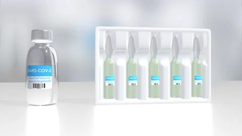 Glass vials for liquid samples of coronavirus vaccine in 4k video. Stock Footage 155060077