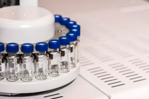 Glass vials for liquid samples. Laboratory equipment for dispensing fluid sam Stock Photos