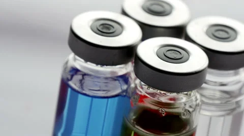 Glass vials rotating CU, 4k, UHD Stock Footage 50001417