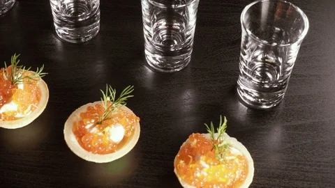 A glass of vodka on the table with a snack Stock Footage 92030400