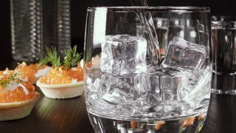 A glass of vodka on the table with a snack Video stock 92031185
