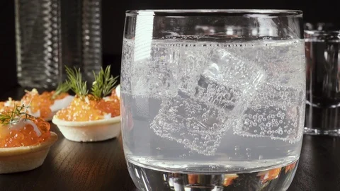 A glass of vodka on the table with a snack Video stock 92031390