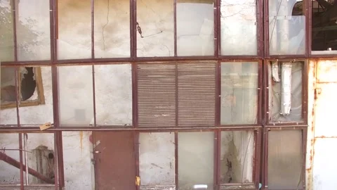Glass wall of a building with broken windows Stock-Footage 88485703