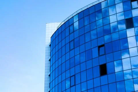 Glass wall facade with cloud sky reflection. Modern urban architecture backgr Stock-Fotos