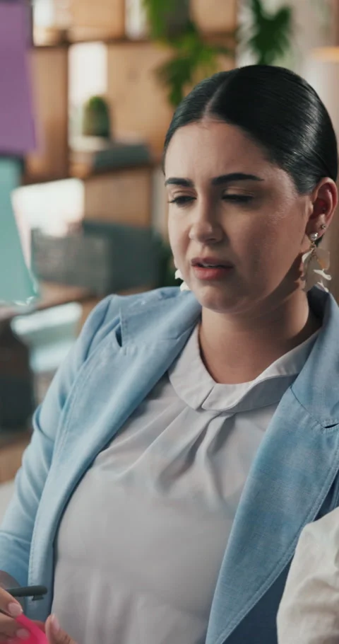 Glass wall, sticky notes and teamwork with business woman in office for Stock Footage 331124000