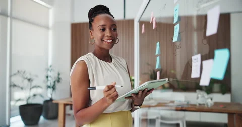 Glass wall, tablet and black woman in office with information, ideas or research Stock Footage 331057511