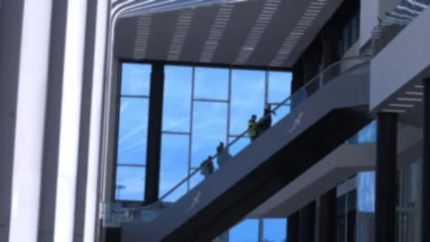 Glass-walled escalator inside contemporary building Stock Footage 342035514