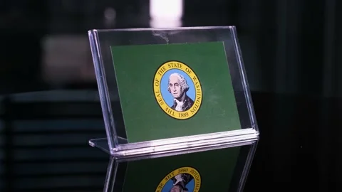 Glass Washington Flag Rotating On Table 動画素材 208470383