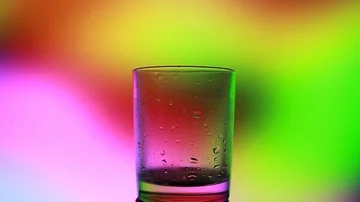 A glass of water on a beautiful background Stock Footage 85676644