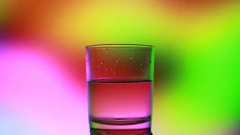 A glass of water on a beautiful background Stock Footage 85676646