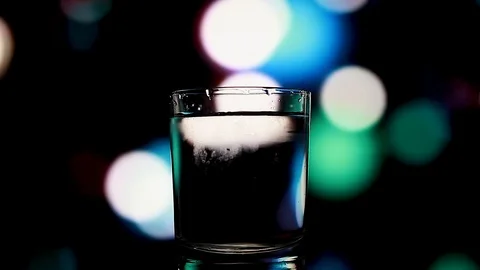 A glass of water on a beautiful background Stock Footage 85676663