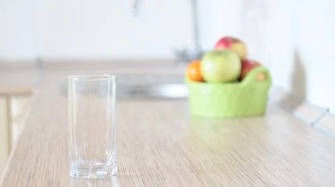 Glass of water in the kitchen Stock Footage 1073168