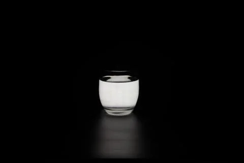 Glass of water lights black background,light in the dark Stock Photos