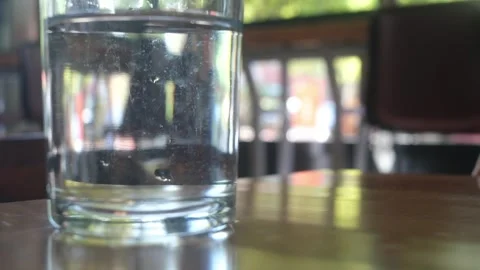 Glass of water on table at an empty resturant Portland OR USA September 2nd 2025 Stock Footage 316200018