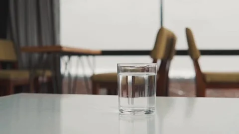 Glass of water on the table Stock Footage 81478901
