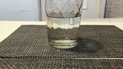 A glass of water is on the table Stock-Footage 98752338