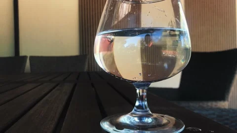 A glass of water is on the table. Stock Footage 162699013