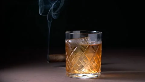 Glass of whiskey and ice Stock Footage 249609130
