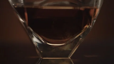 Glass with whiskey on a table Stock Footage 90755331