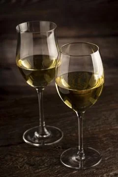 Glass of white wine on the table. Stock Photos