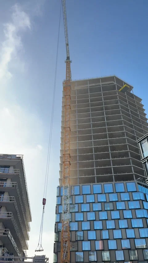 Glass window elements being lifted in office tower 動画素材 302380359