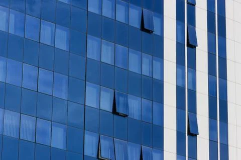 Glass windows of a corporate office building Stock Photos