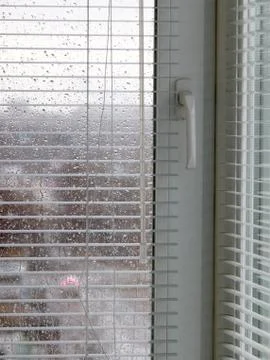 Glass windows with plastic blinds Stock Photos
