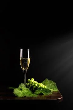 Glass of wine and grapes Stock Photos