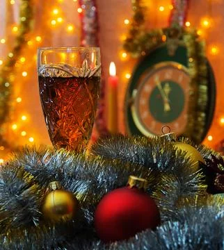 Glass of wine on the background of the clock with the lack of focus Stock Photos