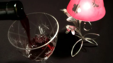 A glass of wine on a background of lights 스톡 동영상 11134581