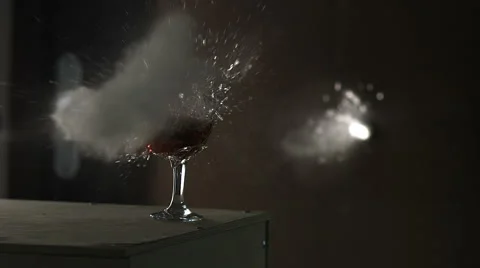 A glass of wine is broken and splintering into small pieces. Video stock 62899945