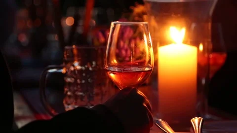 Glass of wine at a candlelight dinner Stock Footage 70098808