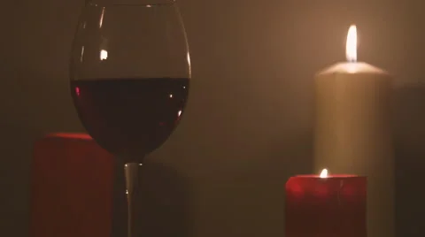 A glass of wine with candles 스톡 동영상 61878481