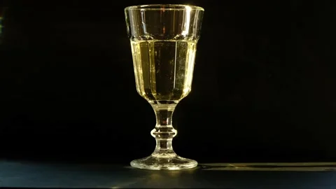 Glass of wine on a dark background Stock-Footage 130535391